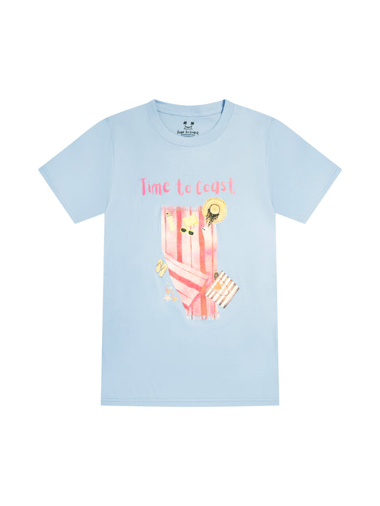 light blue laydown of a graphic t-shirt in organic cotton made in USA. Homegrown t-shirt with large front colorful graphic of beach towel and beach essentials; hats, sunglasses, water bottle, bag and Time to Coast Logo.