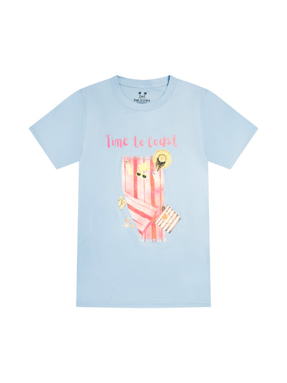 light blue laydown of a graphic  t-shirt in organic cotton made in USA.  Homegrown t-shirt with large front colorful graphic of beach towel and beach essentials; hats, sunglasses, water bottle, bag and Time to Coast Logo.  