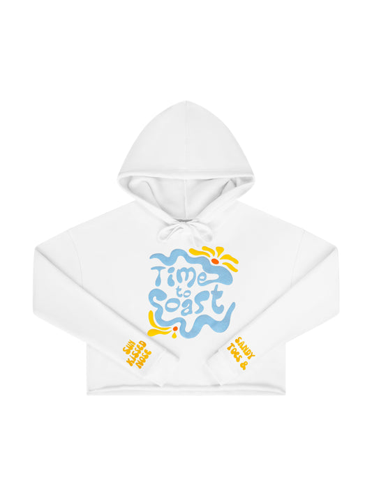 Laydown of a Florida Fleece White Cropped Hoodie Graphic Top.  Graphic is the Time to Coast Hippy Wave in light blue and yellow.  Both sleeves have yellow words of sandy toes &  nose.