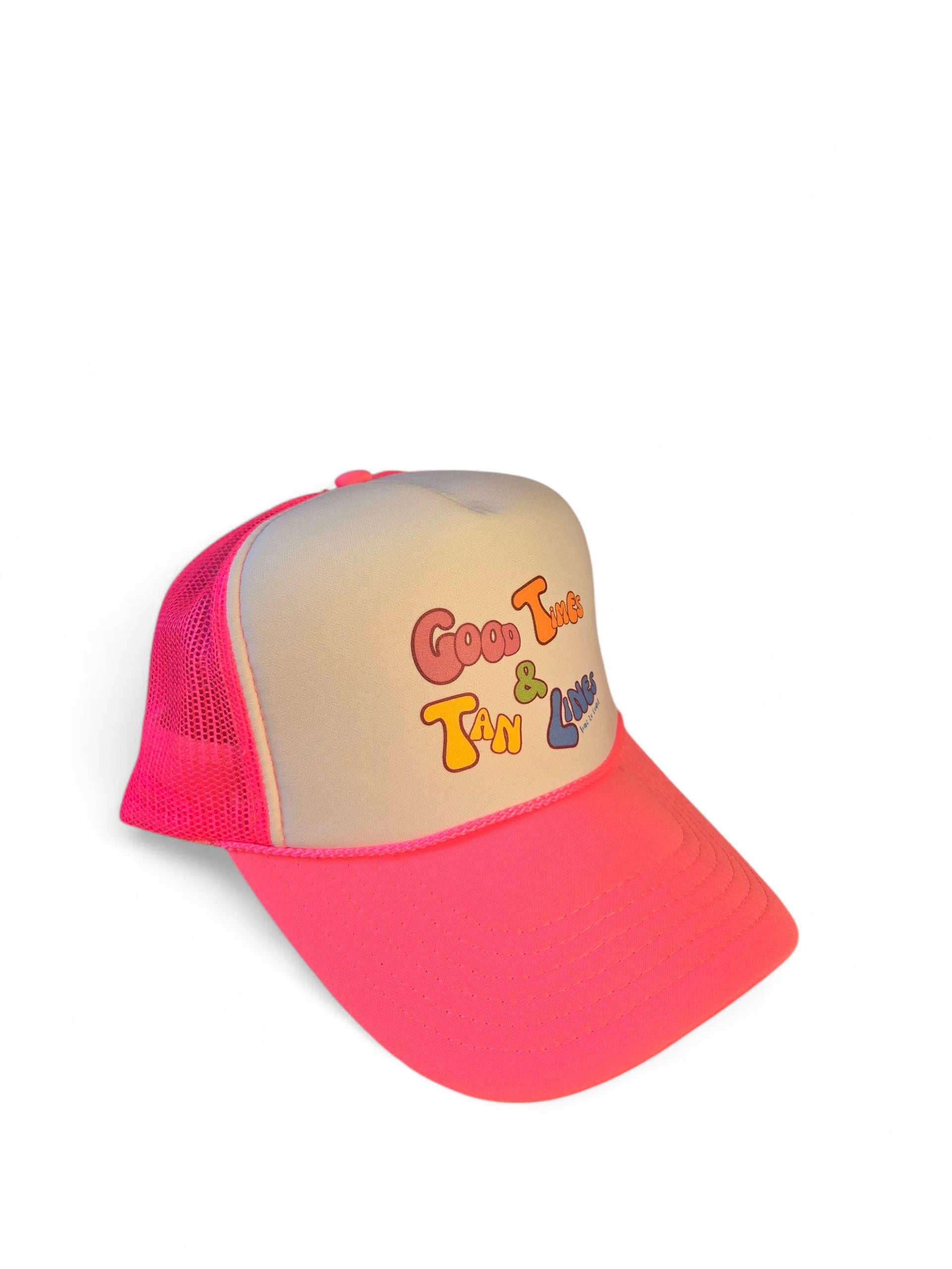 Side view laydown of a foam high profile trucker hat.  Graphic is printed with Time to Coast Good Times and Tan Lines slogan. Hat color is bright pink bill and mesh back with white front. 