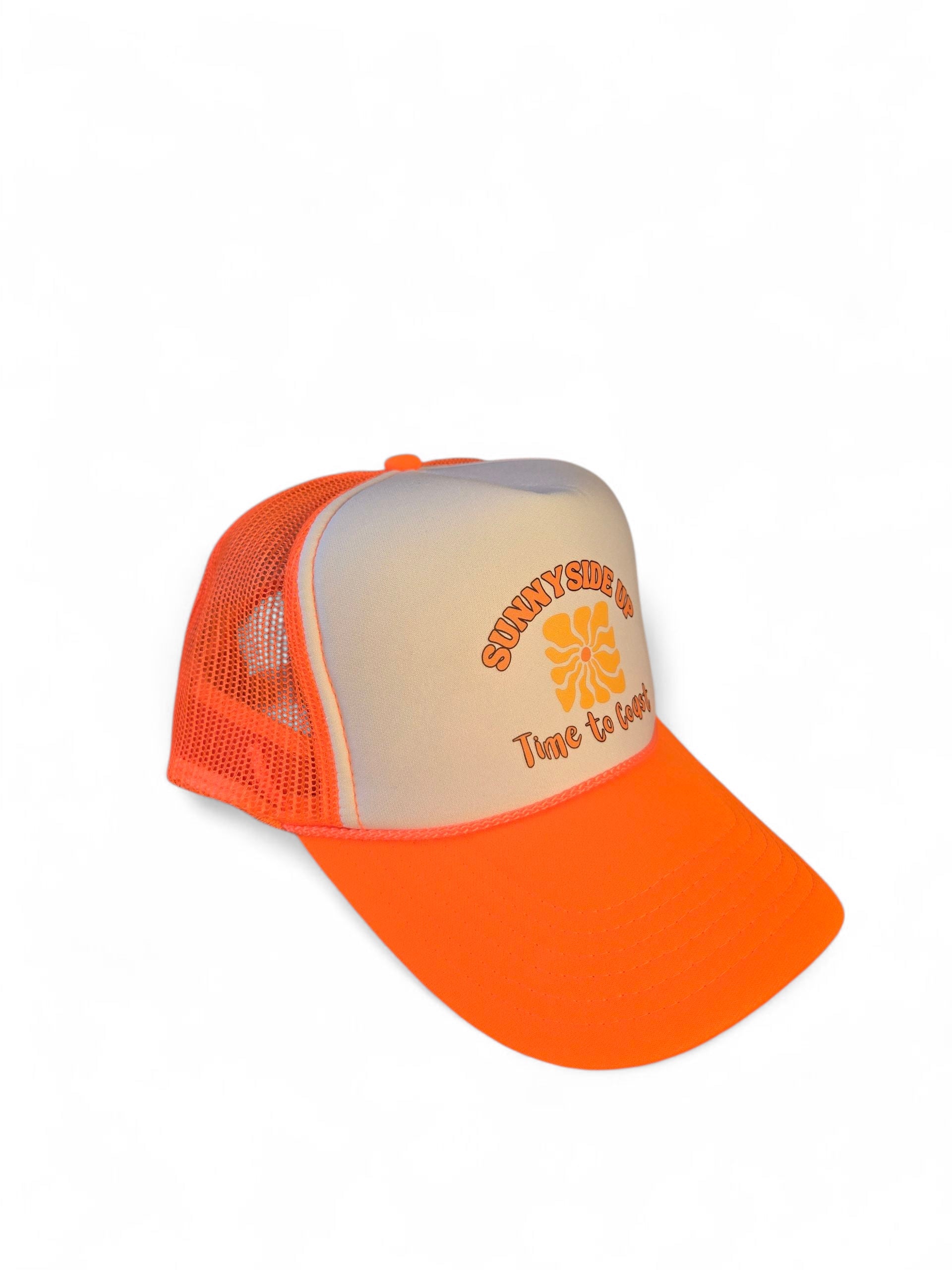side view laydown of a foam high profile trucker hat.  Graphic is printed with Time to Coast Sunnyside Up Sun. Hat color is bright orange bill and mesh back with white front. 