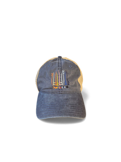 Laydown of the Board Meeting embroidered Time to Coast washed twill navy low profile trucker hat with tan mesh back. Embroidered graphic is of surf and sup boards in multi colors.