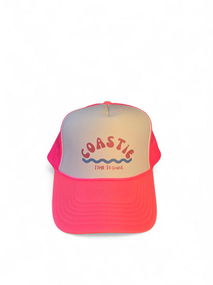 Laydown of a foam high profile trucker hat.  Graphic is printed with Time to Coast Coastie with waves. Hat color is bright pink bill and mesh back with white front. 